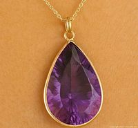 Front view of pear amethyst pendant on chain