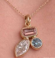 Pendant on chain showing overall design and stone colours