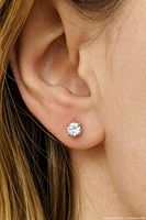 Diamond stud earring shown worn on ear