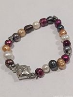 Full view of multicolour freshwater pearl bracelet with decorative clasp