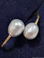 Top view of ring showing two freshwater pearls on band