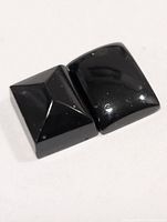 Two black onyx stones side by side