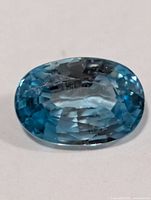 Top view of blue zircon showing oval cut facets