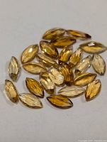 Group of marquise-cut citrine stones in varying yellow tones