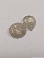 Close-up of two loose Zultanite gemstones