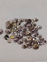 Group of loose faceted garnets showing color range and cuts