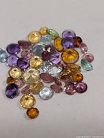 Group of assorted gemstones on white background