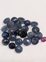 Loose faceted sapphires spread out
