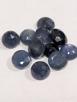 Close view of loose round blue sapphires