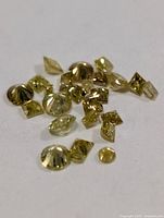 Group of assorted yellow diamonds on white background