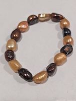 Full view of bracelet showing all pearls and colours