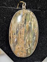 Front view of jasper pendant showing stone pattern and silver bezel