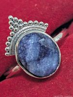 Front view showing sapphire cabochon and crown accent