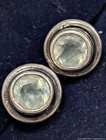 Front view of the moonstone earrings showing stones and bezel settings