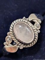 Front view showing moonstone cabochon and rope bezel