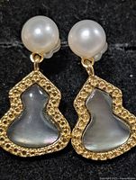 Front view of both earrings showing pearls and mother-of-pearl drops