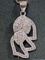 Front view of silver CZ pendant showing overall design and stone setting