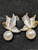 Front view showing leaf motif and pearls