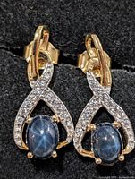 Front view showing design, gemstones and metal finish