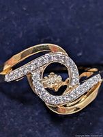 Front view showing dancing diamond and pavé swirl design