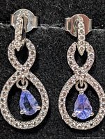 front view of both sterling silver tanzanite & CZ earrings