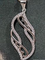 Front view of silver CZ pendant, bail visible