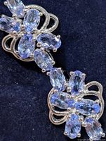 Close-up of tanzanite cluster showing stone arrangement and silver prong settings