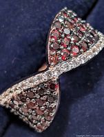 Front view showing garnet and CZ crossover design