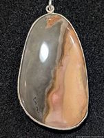 Front view of silver bezel-set Botswana agate pendant