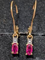 Front view showing ruby stones, accent stones and leverback design