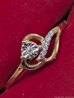 front view showing central diamond and accent diamonds