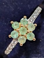 Top view showing emerald cluster and accent stones