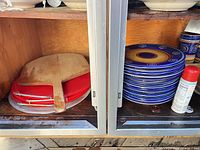 Wooden pizza peel, metal pizza pan, stack showing plate design