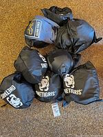 Group of helmet bags branded OneTigris with Call of Duty t-shirt visible