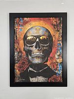 Full view of framed artwork showing skull motif and overall color scheme