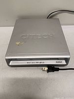 Top view of CiTECH T201DVD DVD player showing embossed logo and attached power cord