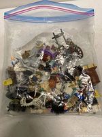 Full view of sealed zipper bag with mixed LEGO minifigure parts