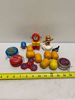 Entire toy lot overview with ruler for scale
