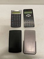 Front view of both calculators with covers detached