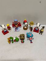 All eleven pop culture figures displayed together on tabletop