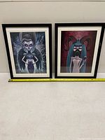 Front view both framed prints with measuring tape