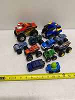 Group shot of all vehicles with measuring tape for scale