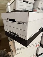 Stack of clean Bankers Box R-Kive 724 cardboard storage boxes with lids