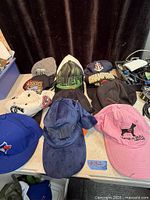 Overall view of most caps laid out on table