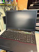 Open Fujitsu EB554 laptop computer showing keyboard and screen