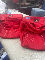 Front view of both red Cannondale pannier bags