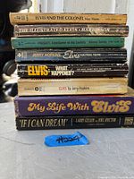 Stack of 8 Elvis Presley books showing titles and authors
