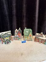 Four porcelain Christmas houses front view