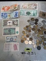 Full lot showing all banknotes and coin pile