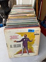 Front view of stacked vinyl records showing Al Jolson LP